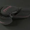 Side profile of the Predator Series pink accent 10oz womens boxing glove showing series branding.