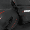 Predator Series boxing gloves in black with red accents, 14oz, shown in a hero close-up.