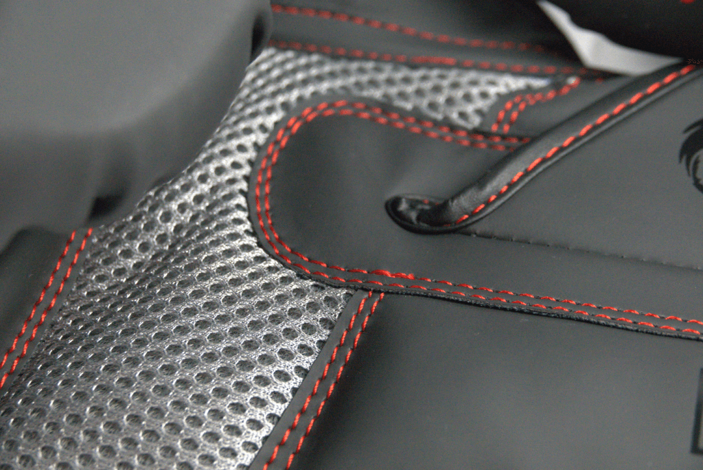 Predator Series Boxing Gloves – Palm Ventilation Close-up Close-up of the Predator Series boxing gloves palm area showing mesh ventilation and red stitching.