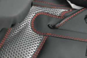 Close-up of the Predator Series boxing gloves palm area showing mesh ventilation and red stitching.