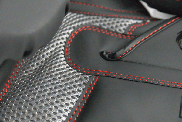 Close-up of the Predator Series boxing gloves palm area showing mesh ventilation and red stitching.