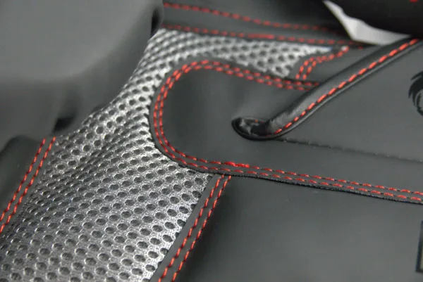 Close-up of the Predator Series boxing gloves palm area showing mesh ventilation and red stitching.