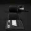 Black Predator Series boxing hand wrap unrolled towards the camera with the label upright in the background.