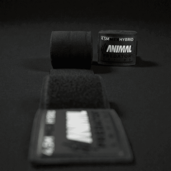Black Predator Series boxing hand wrap unrolled towards the camera with the label upright in the background.