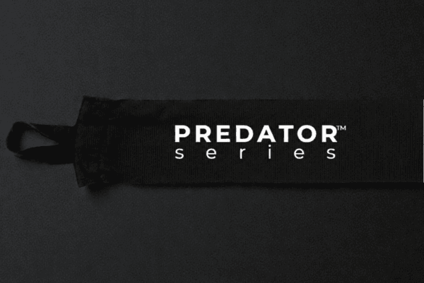 Black Predator Series boxing hand wrap laid flat showing thumb loop and starting end.