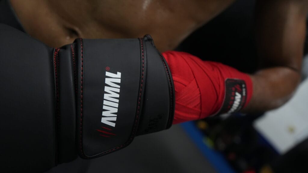 Wrist support and hand wrap use inside training gloves Boxing glove wrist support and hand wrap integration during training