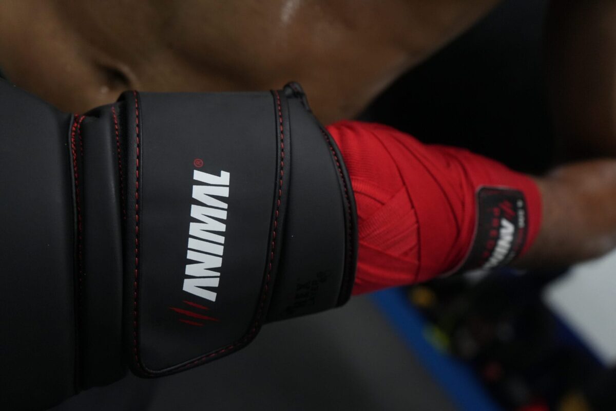 Boxing glove wrist support and hand wrap integration during training
