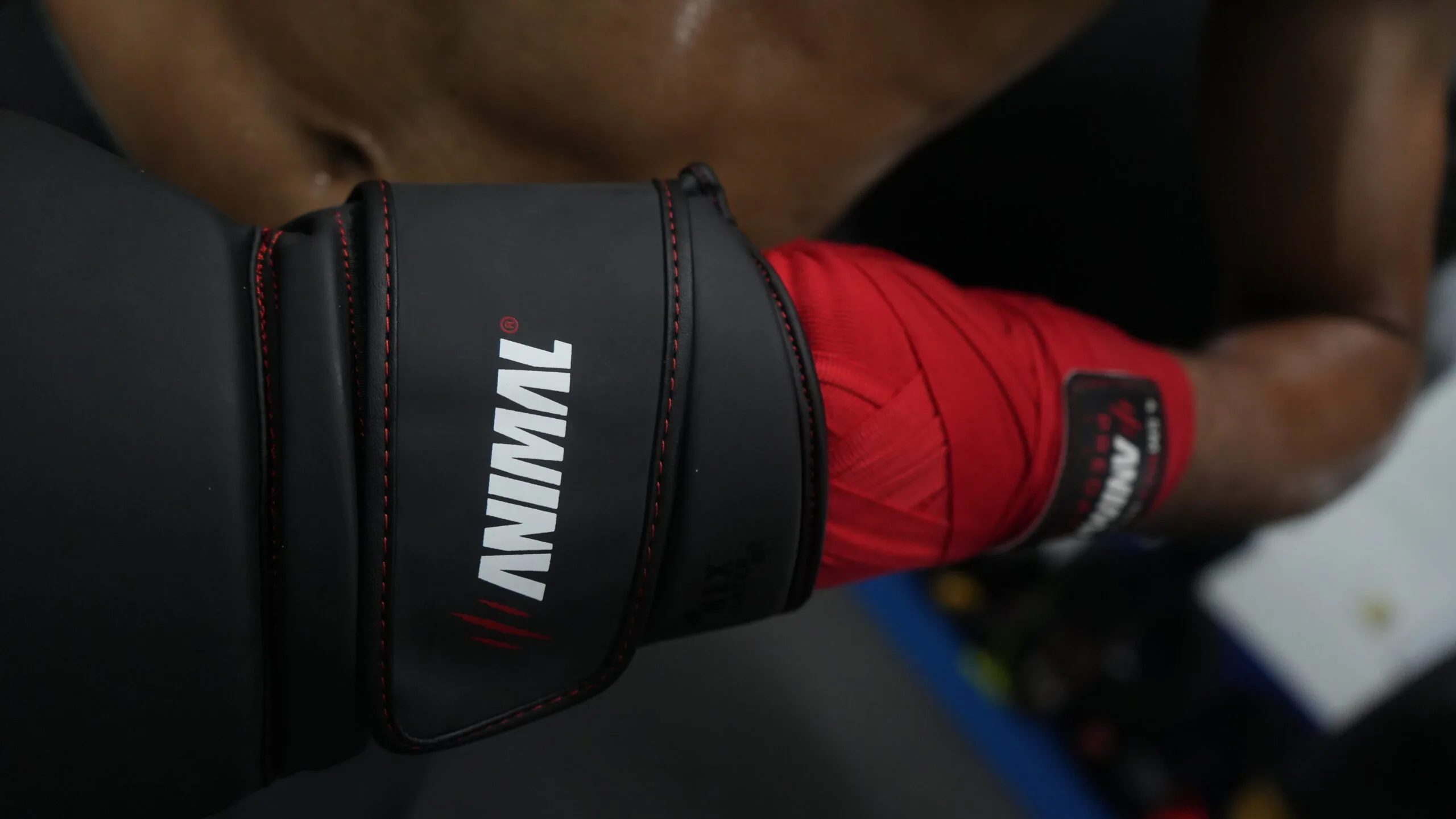Boxing glove wrist support and hand wrap integration during training