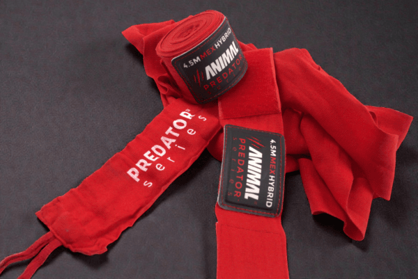 Close-up of the Predator Series red boxing hand wraps showing stitching, weave texture and product label.