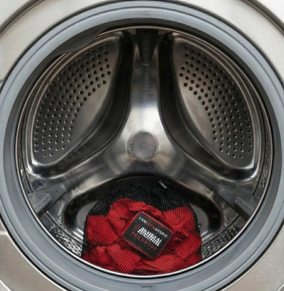 Washing boxing hand wraps safely using a netted laundry bag How to wash Boxing hand wraps placed inside a netted laundry bag in a washing machine drum to prevent tangling and fabric damage.